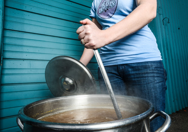 metal kettle on a whirlpool electric stove top boiling water in a